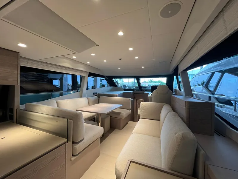 Slide: The Image of Luxurious interior of the 2024 Ferretti Yachts 500, featuring modern seating and dining area. - 17