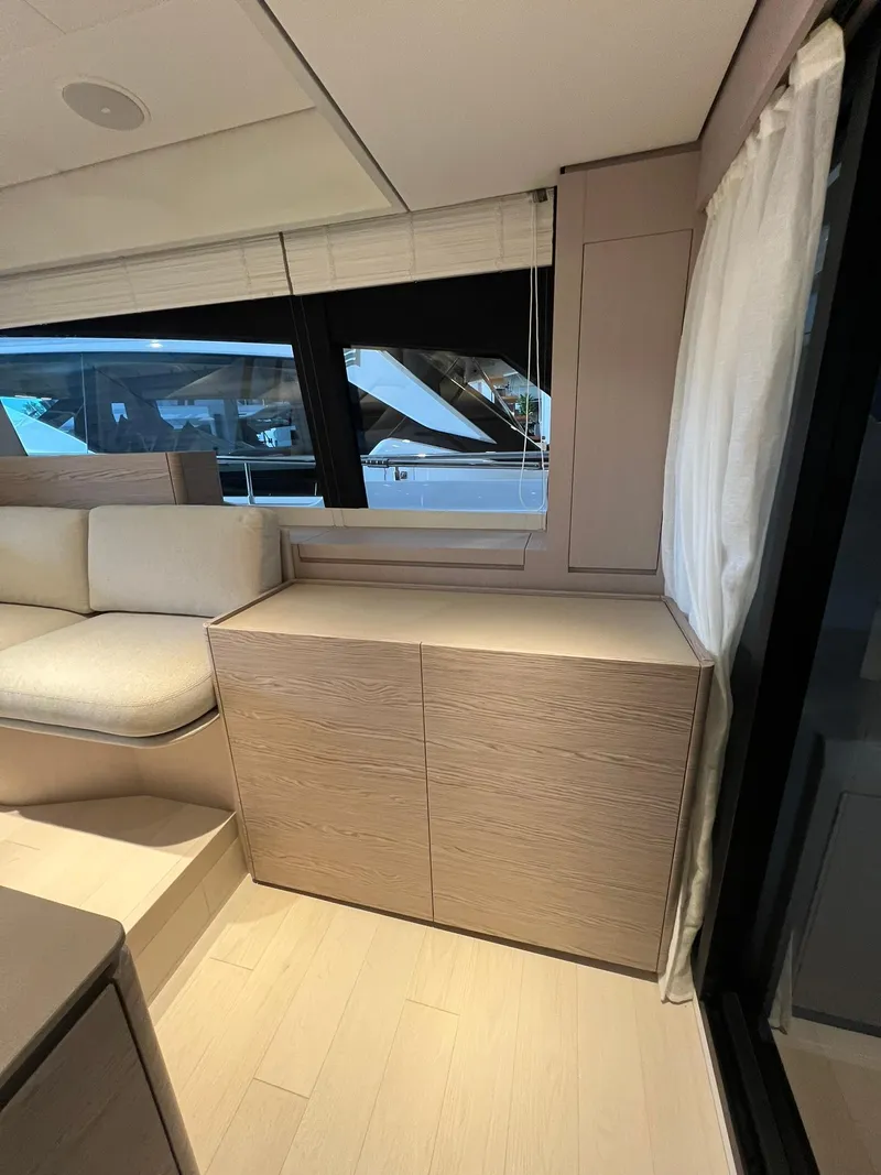 Slide: The Image of Modern interior of 2024 Ferretti Yachts 500 with sleek cabinetry and large windows. - 25