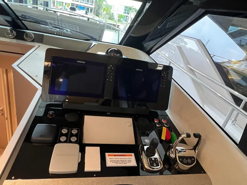 Slide: The Image of Control panel of 2024 Ferretti Yachts 500 with dual navigation screens. - 27