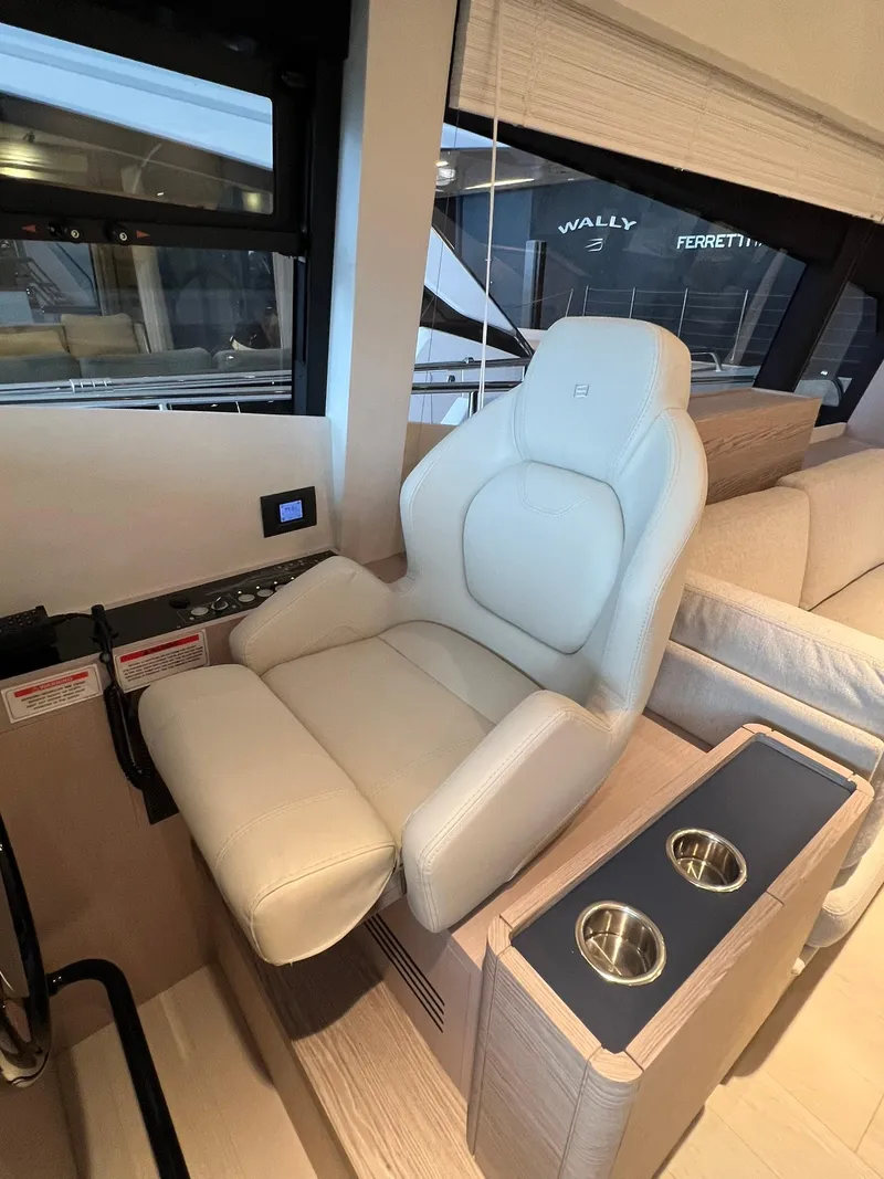 Slide: The Image of Luxurious captain's chair on the 2024 Ferretti Yachts 500, featuring modern design and comfort. - 30