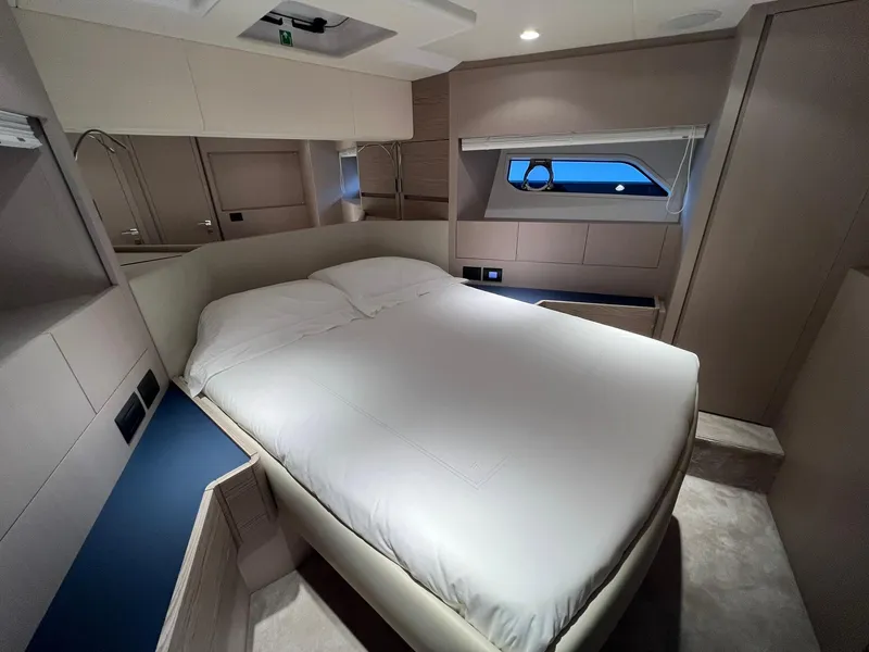 Slide: The Image of 2024 Ferretti Yachts 500 master bedroom with modern design and large bed. - 38