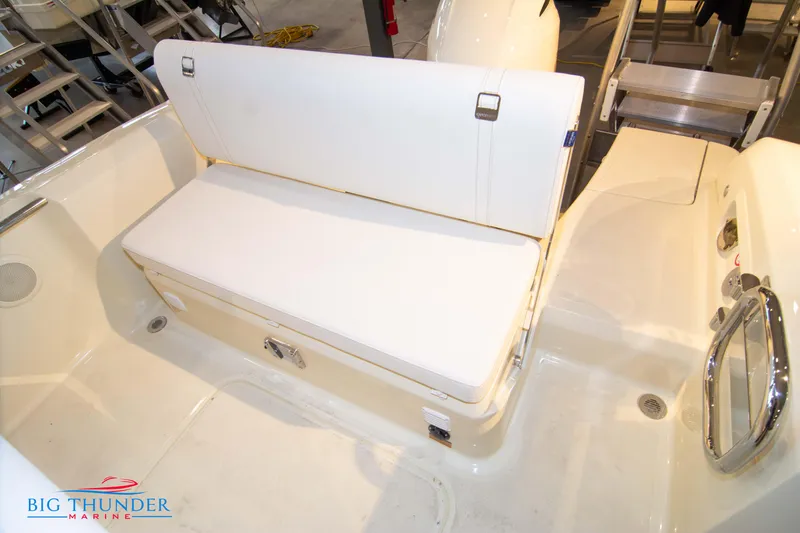 Slide: The Image of 2024 Capoforte SX200 boat interior with white cushioned seating. - 13