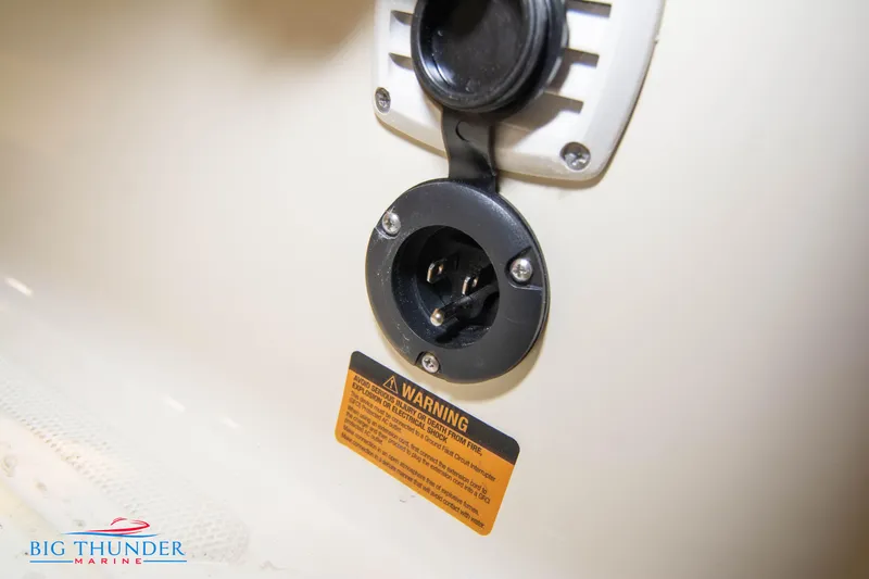Slide: The Image of Close-up of Capoforte SX200 2024 boat's electrical outlet with warning label. - 15