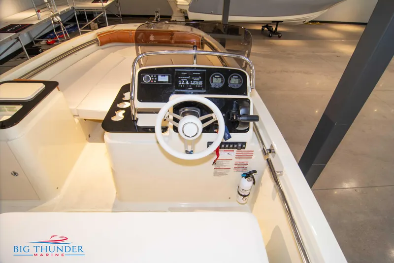 Slide: The Image of 2024 Capoforte SX200 boat interior with steering wheel and control panel. - 16