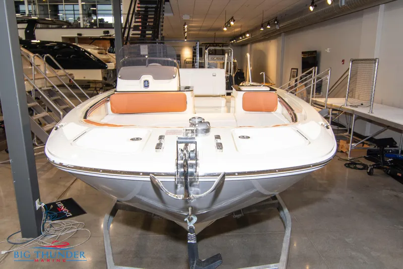 Slide: The Image of 2024 Capoforte SX200 boat on display in showroom. - 1