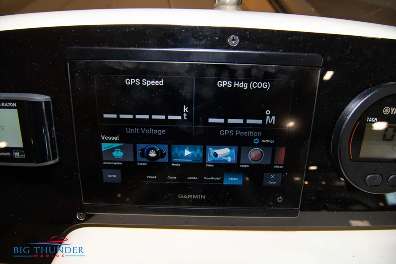 Slide: The Image of 2024 Capoforte SX200 boat dashboard with Garmin GPS display and controls. - 19