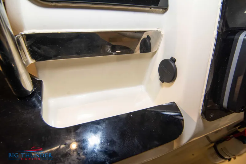Slide: The Image of 2024 Capoforte SX200 boat interior detail with Big Thunder Marine logo. - 23