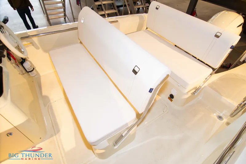 Slide: The Image of 2024 Capoforte SX200 boat interior with white seating, showcased by Big Thunder Marine. - 26