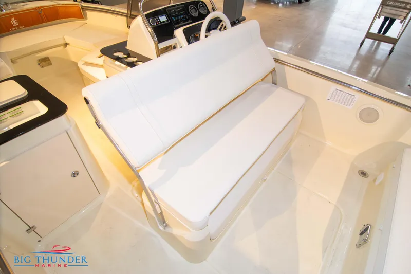 Slide: The Image of 2024 Capoforte SX200 boat interior with white seating and steering console. - 27