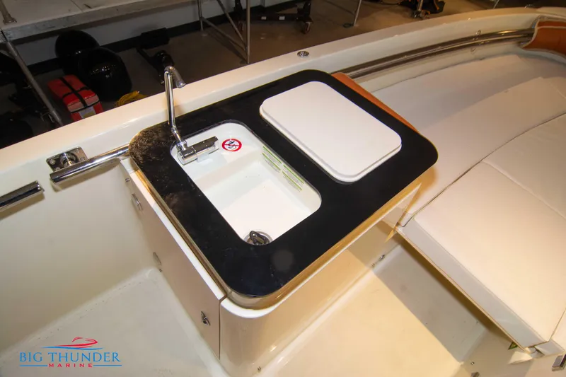 Slide: The Image of 2024 Capoforte SX200 boat sink and storage compartment. - 28