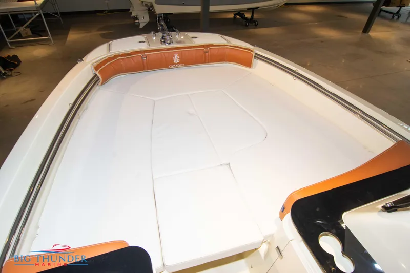 Slide: The Image of 2024 Capoforte SX200 boat interior with white and tan seating. - 30