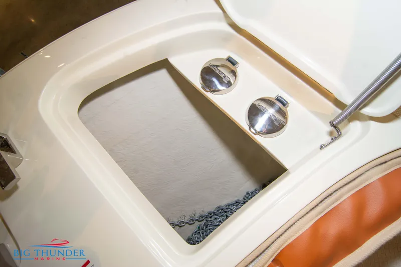 Slide: The Image of Capoforte SX200 2024 boat storage compartment with dual fuel caps. - 33