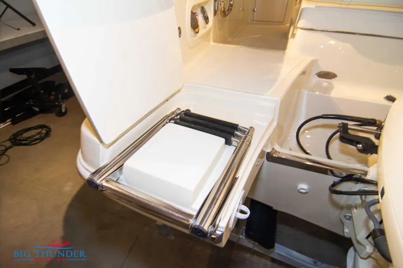 Slide: The Image of 2024 Capoforte SX200 boat with integrated swim ladder and storage compartment. - 7