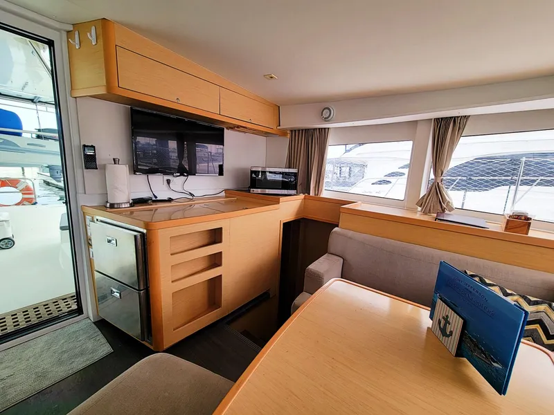 Slide: The Image of Interior of 2017 Lagoon 42 catamaran with modern kitchen and dining area. - 20