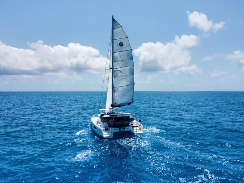 Slide: The Image of Lagoon 42 catamaran sailing on open blue sea, 2017 model. - 33