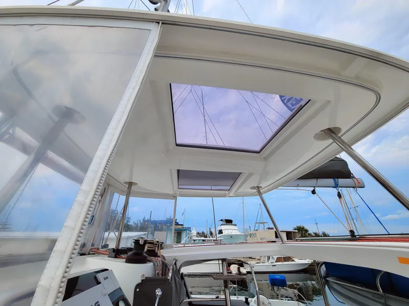Slide: The Image of View from the cockpit of a 2017 Lagoon 42 catamaran in a marina. - 5