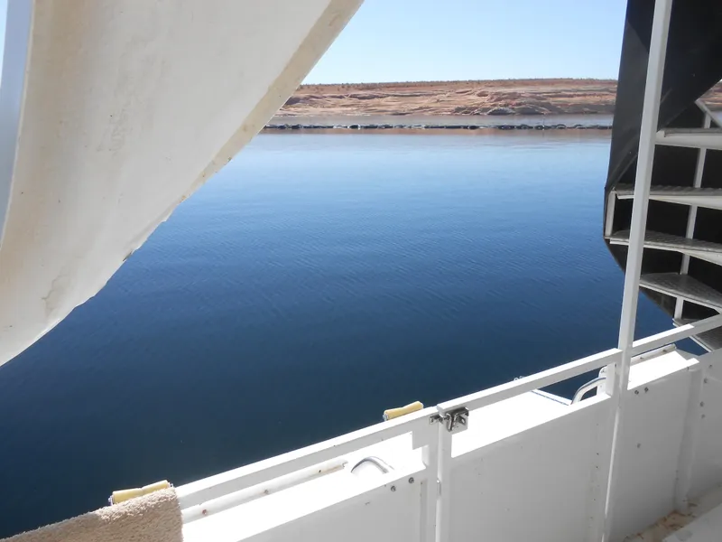 Slide: The Image of View from Skipperliner Custom Houseboat (2000) overlooking calm blue water and distant shoreline. - 34