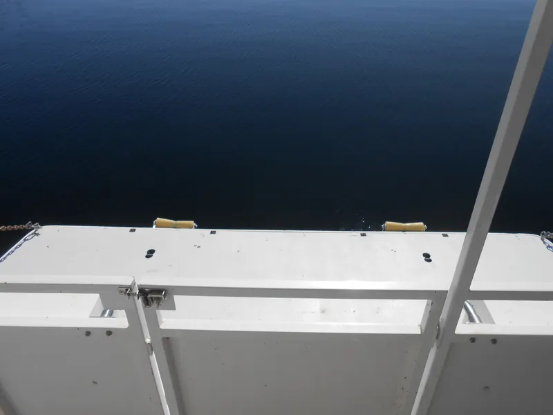 Slide: The Image of View from Skipperliner Custom Houseboat (2000) deck overlooking calm water. - 35