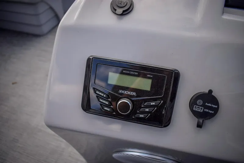 Slide: The Image of 2023 Bennington 21 SLSP boat dashboard with Kicker media center. - 11