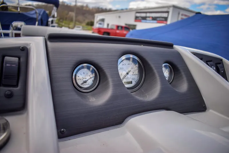 Slide: The Image of Dashboard of a 2023 Bennington 21 SLSP pontoon boat with gauges. - 12