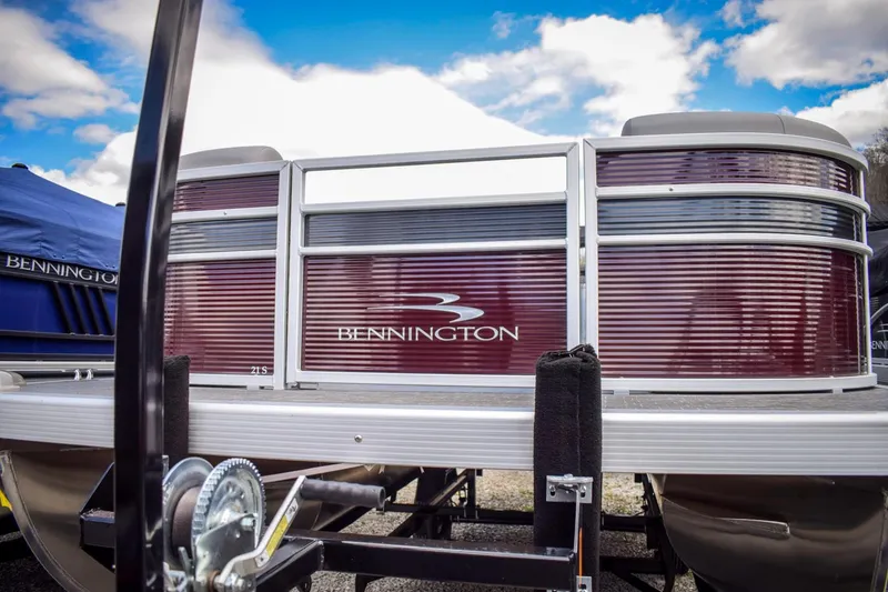 Slide: The Image of 2023 Bennington 21 SLSP pontoon boat with maroon exterior. - 2