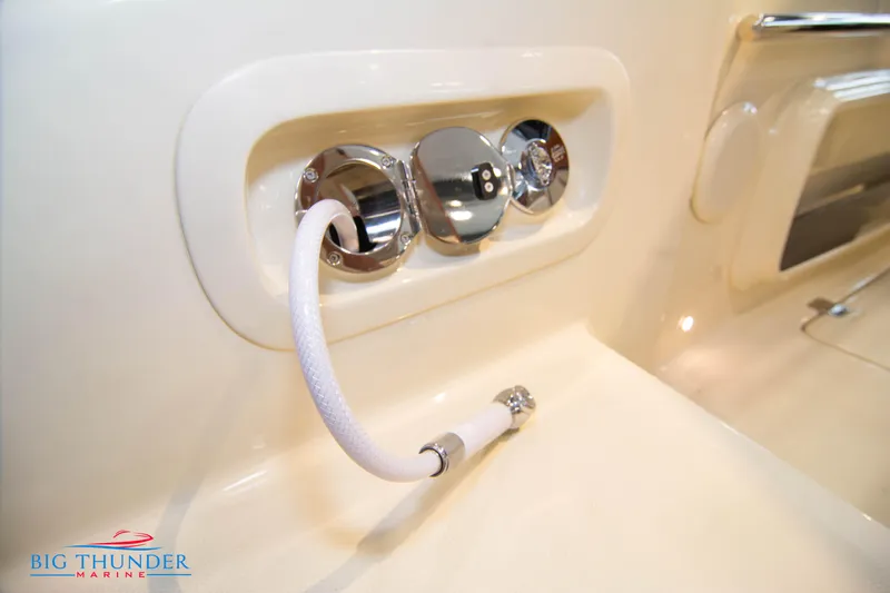 Slide: The Image of Close-up of 2024 Capoforte CX240 boat's chrome fittings and hose. - 11