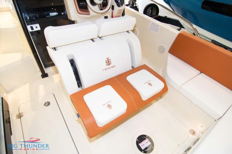 Slide: The Image of 2024 Capoforte CX240 boat interior with white and orange seating. - 20