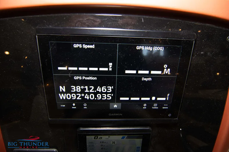 Slide: The Image of Capoforte CX240 2024 boat dashboard with Garmin GPS display showing coordinates and speed. - 24