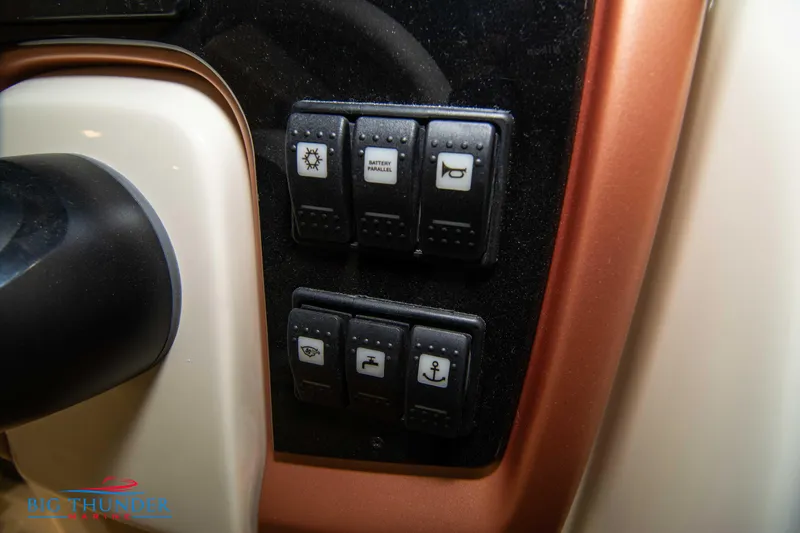 Slide: The Image of Control panel of 2024 Capoforte CX240 boat with various switches. - 27
