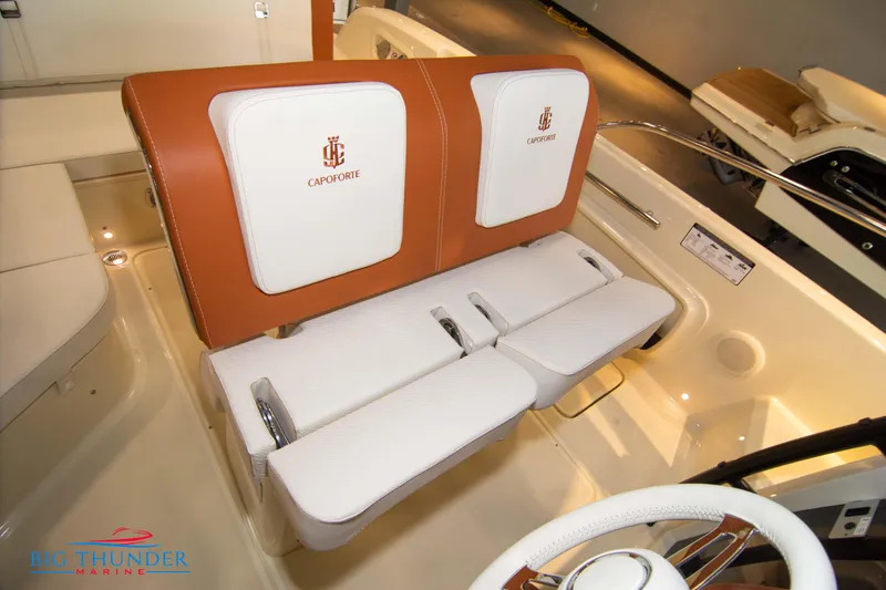 Slide: The Image of 2024 Capoforte CX240 boat interior with white and brown seating. - 35