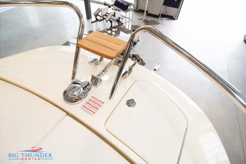 Slide: The Image of Capoforte CX240 2024 boat deck with stainless steel railings and wooden seat. - 38