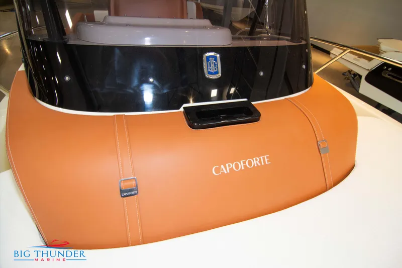 Slide: The Image of 2024 Capoforte CX240 boat dashboard with orange leather detailing. - 41