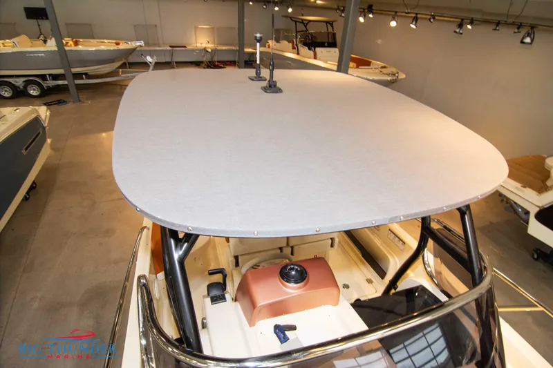 Slide: The Image of 2024 Capoforte CX240 boat interior and helm station in showroom. - 42