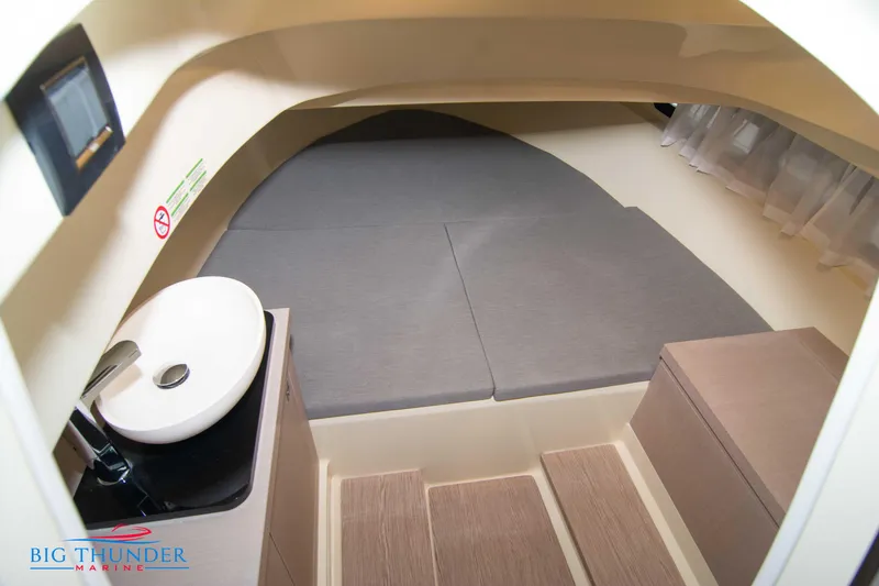 Slide: The Image of Interior cabin of 2024 Capoforte CX240 boat with bed, sink, and stairs. - 43