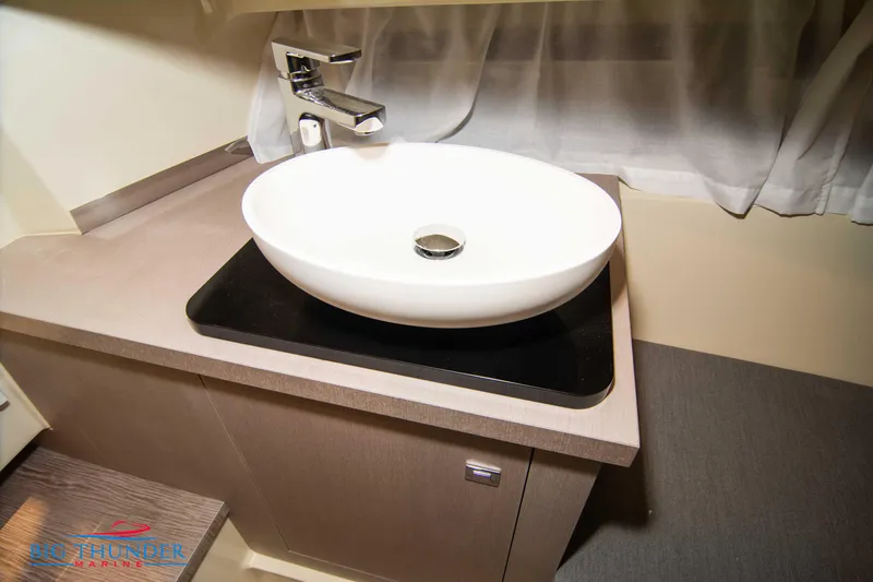 Slide: The Image of Modern bathroom sink in the 2024 Capoforte CX240 boat. - 47