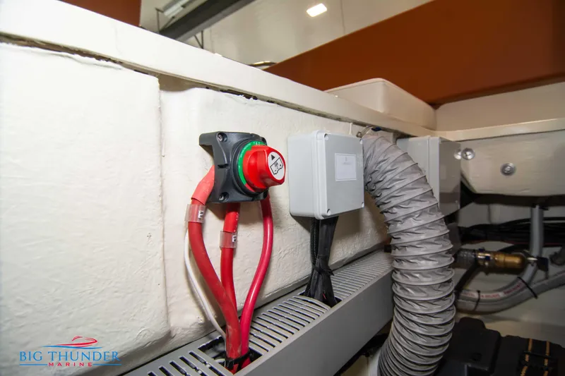Slide: The Image of Electrical components and wiring inside a 2024 Capoforte CX240 boat. - 49