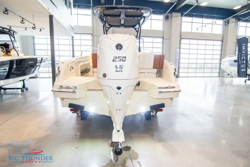 Slide: The Image of 2024 Capoforte CX240 boat displayed in a showroom with a 250 V6 engine. - 5