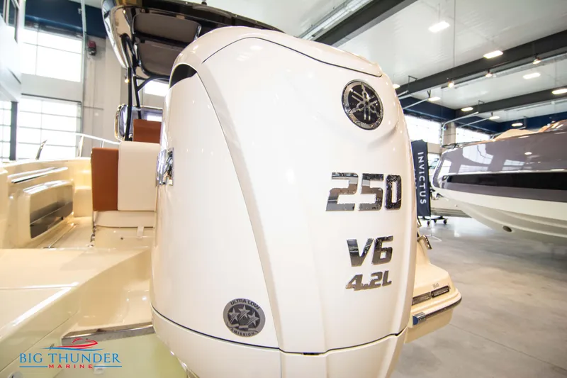 Slide: The Image of 2024 Capoforte CX240 boat with a 250 V6 4.2L engine in a showroom. - 6