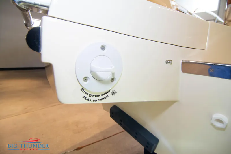 Slide: The Image of Emergency lever on a 2024 Capoforte CX240 boat, labeled Pull to Open. - 9