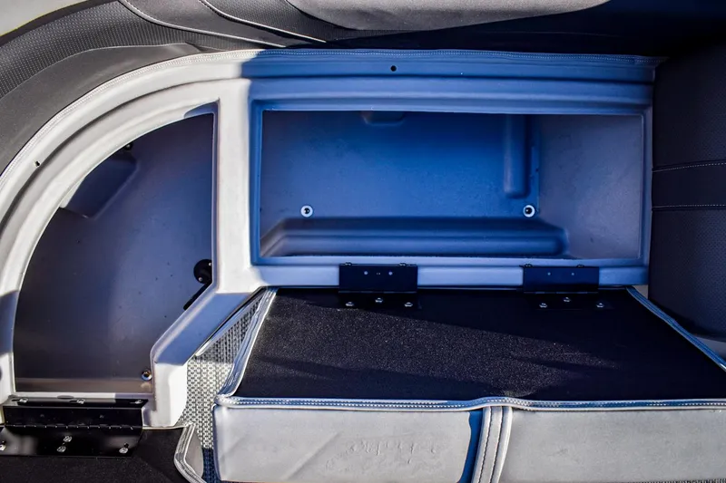 Slide: The Image of 2023 Bennington 22 SXCWSP under-seat storage compartment. - 13