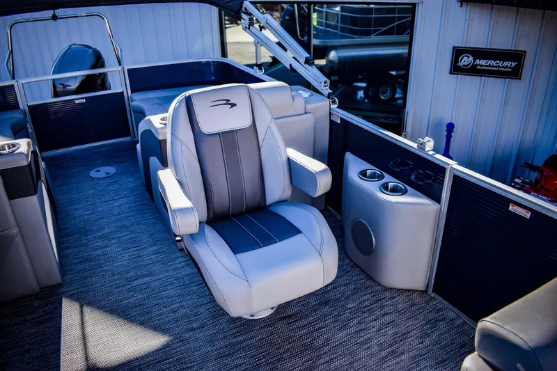 Slide: The Image of 2023 Bennington 22 SXCWSP pontoon boat captain's chair and console. - 18