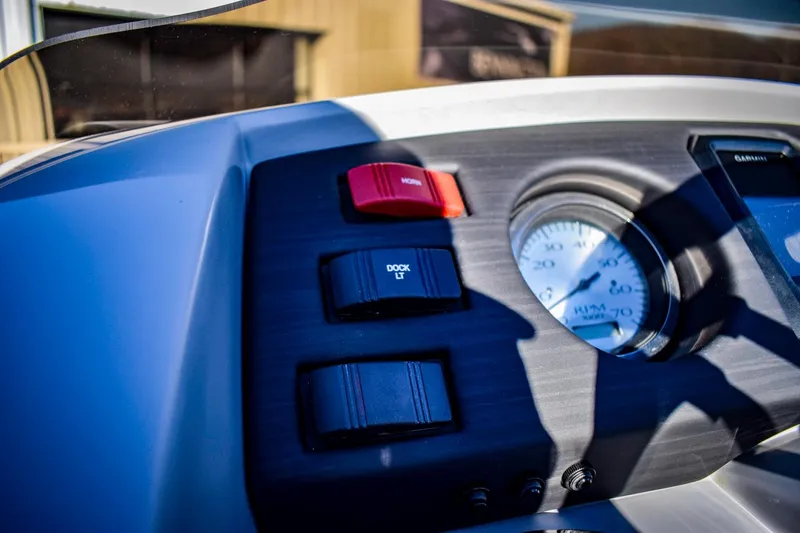 Slide: The Image of Close-up of 2023 Bennington 22 SXCWSP boat dashboard controls and gauge. - 20