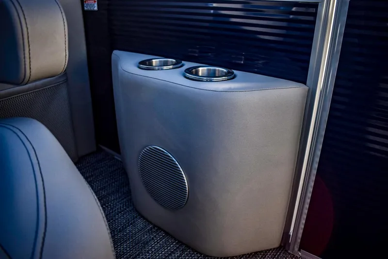 Slide: The Image of 2023 Bennington 22 SXCWSP boat interior with cup holders and speaker. - 26