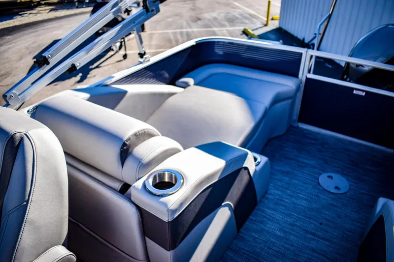 Slide: The Image of 2023 Bennington 22 SXCWSP boat interior with luxurious seating and cup holder. - 28