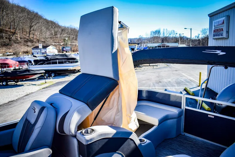 Slide: The Image of 2023 Bennington 22 SXCWSP pontoon boat interior with seating and storage. - 31