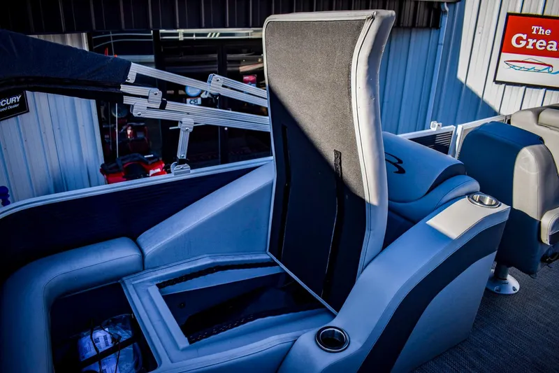 Slide: The Image of 2023 Bennington 22 SXCWSP boat interior with open storage compartment. - 32