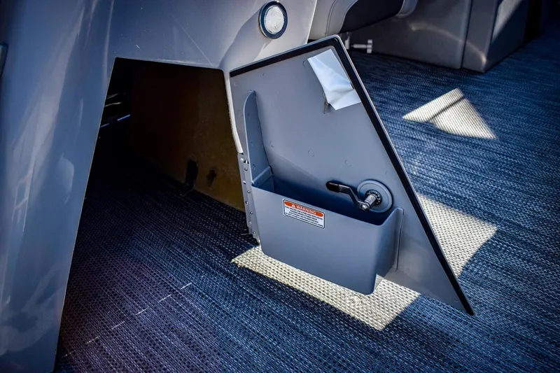 Slide: The Image of 2023 Bennington 22 SXCWSP storage compartment on boat deck. - 34