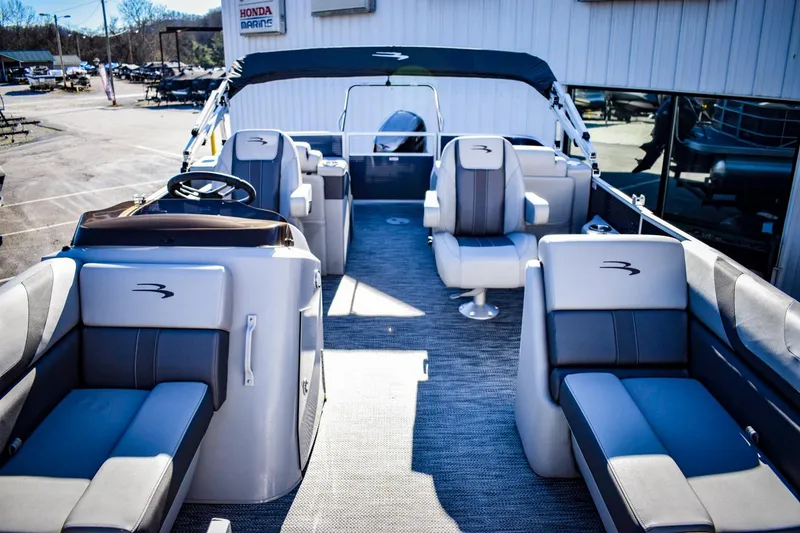Slide: The Image of 2023 Bennington 22 SXCWSP pontoon boat with spacious seating and modern design. - 9