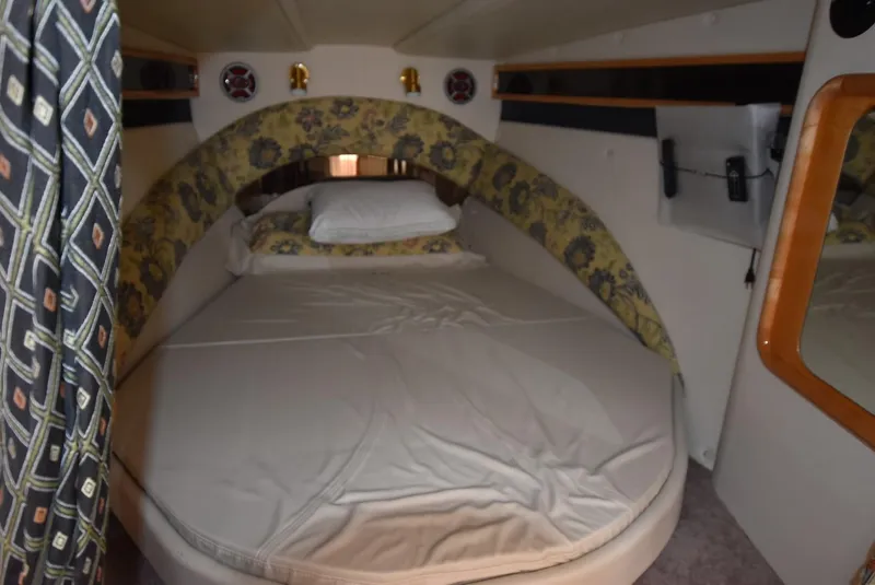 Slide: The Image of Cozy sleeping quarters in a 2002 Black Thunder 460 EC boat. - 18