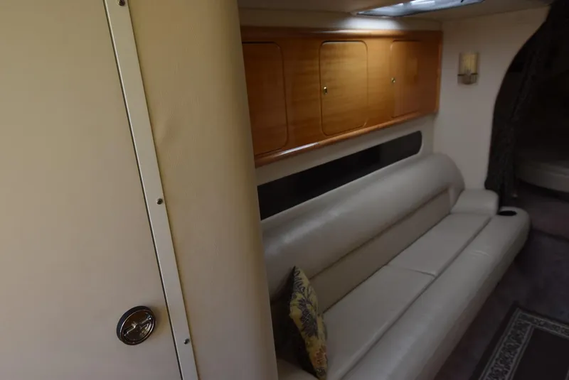 Slide: The Image of Interior of 2002 Black Thunder 460 EC boat with leather sofa and wooden cabinets. - 20